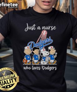 Nice Peanuts Just A Nurse Who Loves Dodgers T-Shirt featuring a fun graphic of Snoopy and baseball elements.