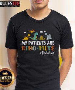 Alt Text: Pediatric nurse wearing 'My Patients Are Dino-Mite' dinosaur T-shirt, showcasing fun and caring approach to child healthcare.
