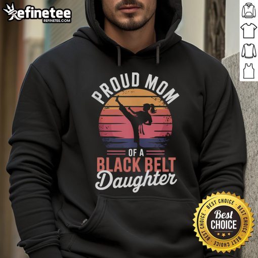Alt Text: Proud mom wearing a hoodie celebrating her daughters black belt achievement in martial arts, showcasing family pride.