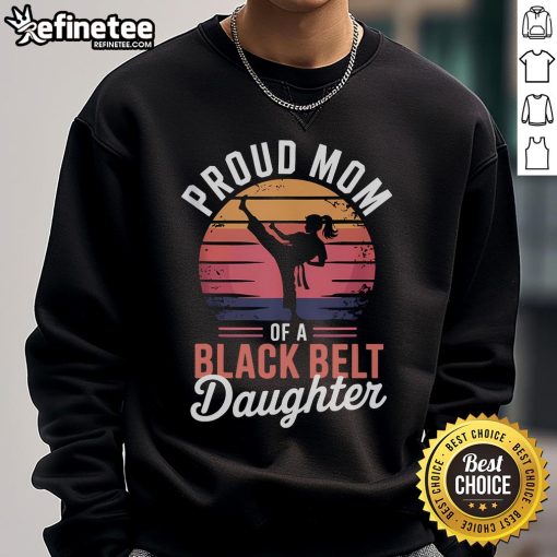 Alt Text: Proud mom wearing a sweatshirt that celebrates her daughters achievement as a black belt in martial arts.