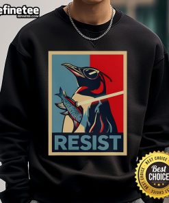 Alt Text: Trendy penguin in sunglasses holding a swordfish, wearing a 'Nice Resist' sweatshirt, perfect for casual protests.