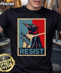 Alt Text: Nice Resist Penguin in sunglasses holding a swordfish t-shirt, symbolizing protest and wildlife conservation.