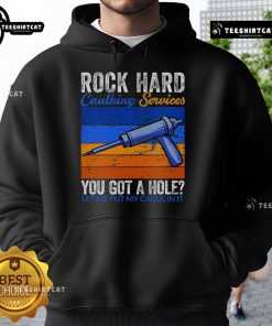 Funny hoodie featuring 'Nice Rock Hard Caulking Services' slogan for DIY enthusiasts and home repair lovers.