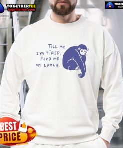 Chimpanzee wearing 'Tell Me I'm Tired, Feed Me My Lunch' sweatshirt, showcasing a fun and cozy vibe with vibrant ruby color.