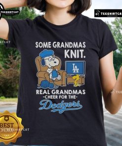 Womens tee featuring Snoopy and Woodstock cheering for the Los Angeles Dodgers, perfect for grandmas and fans alike.