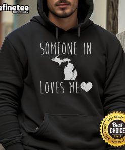 Cozy 'Someone In Michigan State Loves Me' hoodie displayed on a hanger, perfect for showing Michigan State pride.