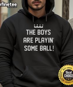 Nice the Boy wearing a hoodie, playing with a ball in a sunny park, showcasing fun and active outdoor play.