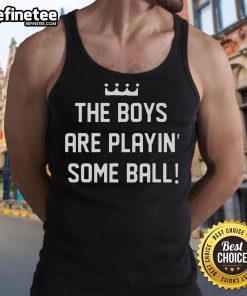 Nice the boy wearing a tank top plays with a ball outdoors, showcasing fun summer activities for kids.