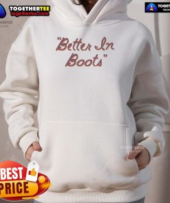 Thomas Rhett wearing a 'Better in Boots' script hoodie, showcasing stylish country music fashion.