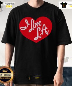 Nice tourist wearing 'I Love La' T-shirt with vibrant cityscape background, showcasing love for Los Angeles.
