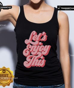 Man in a Nice Vegas Matt tank top, smiling in a vibrant Las Vegas setting, ready to enjoy the fun atmosphere.