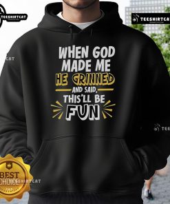 Alt Text: 2025 hoodie featuring the phrase 'When God Made Me, He Grinned and Said This'll Be Fun' in bold letters.