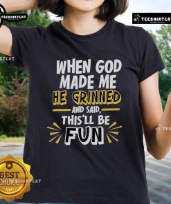 2025 Ladies Tee featuring the phrase 'When God Made Me, He Grinned and Said This'll Be Fun' in stylish typography.