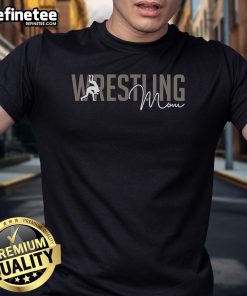 Cool wrestler mother in a stylish t-shirt with a saying, showcasing her support for her child's wrestling passion.