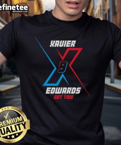 Xavier Edwards wearing a stylish t-shirt featuring his name, showcasing his unique fashion sense and personality.