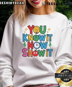 Alt Text: Teacher wearing a motivational sweatshirt on Testing Day, showcasing the 'Nice, You Know It, Now Show It' design.
