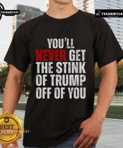 Alt Text: Funny Trumpsmells T-Shirt featuring 'Nice You'll Never Get The Stink Of Trump Off Of You' slogan, perfect for political satire.
