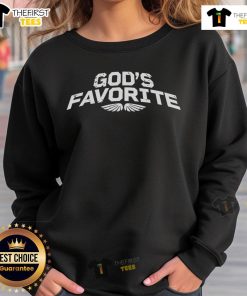 Officer Eudy wearing 'God's Favorite' sweatshirt, showcasing a stylish and meaningful design for faith-inspired fashion.