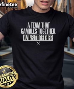 Official A Team That Gambles Together Wins Together Baseball T-Shirt in vibrant colors, perfect for team spirit and camaraderie.