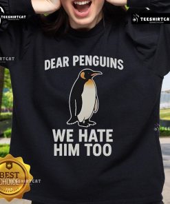 Alt Text: Official Dear Penguins We Hate Him Too Sweatshirt featuring bold text and a stylish design for penguin fans.