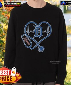 Alt Text: Official Detroit Tigers Caring Hearts Nurses Sweatshirt featuring team logo and heart design for healthcare heroes.
