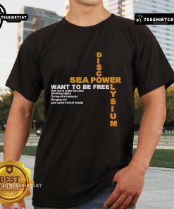 Alt Text: Official Disco Elysium Sea Power Want To Be Free T-Shirt featuring vibrant artwork and bold text design.
