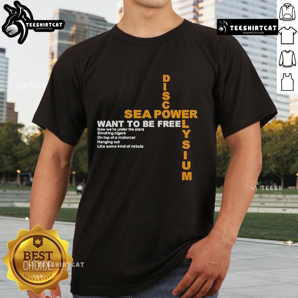 Official Disco Elysium Sea Power Want To Be Free T Shirt Alt Text: Official Disco Elysium Sea Power Want To Be Free T-Shirt featuring vibrant artwork and bold text design.