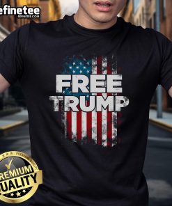 Alt Text: Official Free Trump America Flag T-Shirt featuring a bold American flag design and 'Free Trump' slogan.