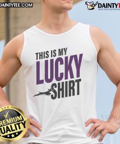 Person wearing a lucky tank top at the Grand Canyon with antelopes in the background, showcasing the scenic view.