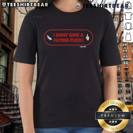 Alt Text: Official I Don't Give A Flying F*ck Red Pill Ladies Tee featuring bold graphic design on a stylish women's shirt.