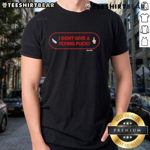 Official I Don't Give A Flying Fuck Red Pill T-Shirt featuring bold graphic text on a casual red shirt design.
