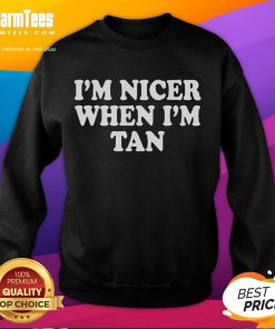 Stylish 'Official I'm Nicer When I'm Tan' sweatshirt in a cozy setting, perfect for casual wear and summer vibes.