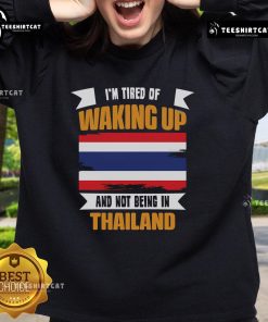 Cozy 'I'm Tired of Waking Up and Not Being in Thailand' sweatshirt in vibrant colors, perfect for travel lovers.