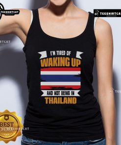 Official 'I'm Tired of Waking Up and Not Being in Thailand' tank top showcasing a vibrant design for travel enthusiasts.
