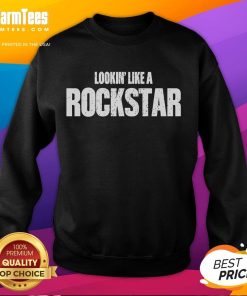 Josh Ross wearing a stylish 'Lookin Like A Rockstar' sweatshirt, showcasing a trendy and casual look.