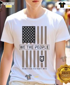 Official People Stamp 'We The People' Howitzer Patriot Mfg T-Shirt featuring patriotic design and bold typography.