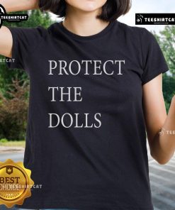 Official Protect The Dolls Ladies Tee featuring stylish design for fans, perfect for casual wear and doll enthusiasts.