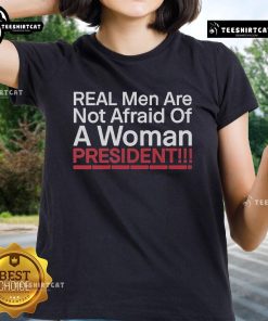 Alt Text: Official Real Men Are Not Afraid of a Woman President Ladies Tee featuring bold graphic design and empowering message.
