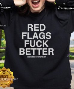 Official Red Flags Fuck Better Assholes Live Forever Sweatshirt in black with bold white text, perfect for casual wear.