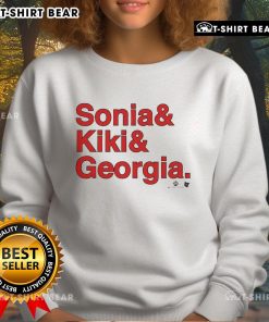 Sonia Citron, Kiki Iriafen, Georgia Amoore wearing Washington Ampersand Sweatshirt at a basketball event.