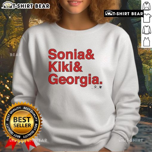 Sonia Citron, Kiki Iriafen, Georgia Amoore wearing Washington Ampersand Sweatshirt at a basketball event.