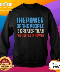Alt Text: Cozy sweatshirt featuring The Power Of The People Is Greater Than The People In Power slogan for activism.