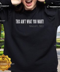 Official This Ain't What You Want Malcolm 1963 quote sweatshirt featuring bold text on a stylish black design.