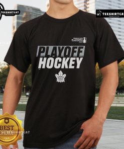 Alt Text: Official Toronto Maple Leafs Stanley Cup Playoffs 2025 T-Shirt featuring team logo and playoff graphics in blue and white.