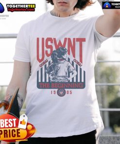 Official USWNT The Beginning 1985 T-Shirt featuring vintage design and bold team colors celebrating women's soccer history.