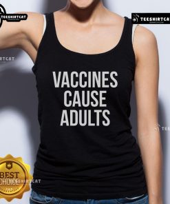 Adult wearing a tank top with the slogan 'Official Vaccines Cause' in a vibrant outdoor setting.