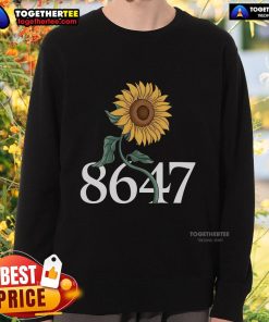 Alt Text: Floral sweatshirt featuring a vibrant sunflower design, perfect for spring fashion and casual outfits.