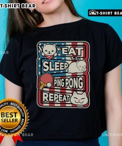 Patriotic ladies tee featuring a cute cat with a 'Eat Sleep Ping Pong Repeat' design, perfect for table tennis fans.