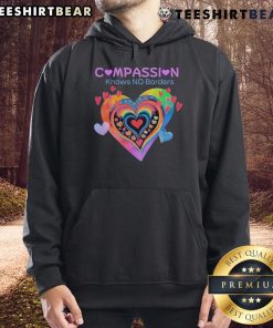 Alt Text: Cozy 'Pretty Compassion Knows No Borders' hoodie featuring heart designs, perfect for spreading love and kindness.