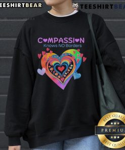 Pretty Compassion Knows No Borders sweatshirt featuring heart designs, perfect for spreading love and kindness.